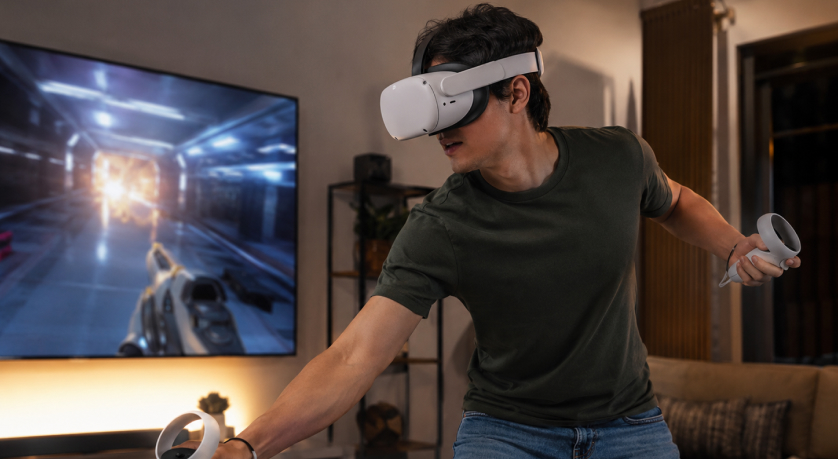 Man using a VR headset and controllers in a premium home entertainment space